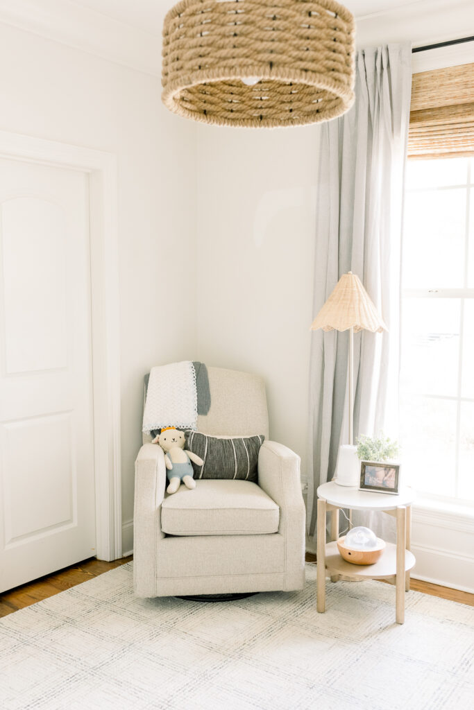 Neutral toned nursery with beautiful natural lighting. Image taken by Madison, MS Newborn Photographer.