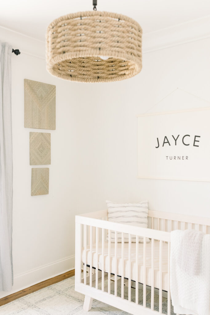 Neutral toned nursery with beautiful natural lighting. Image taken by Madison, MS Newborn Photographer.